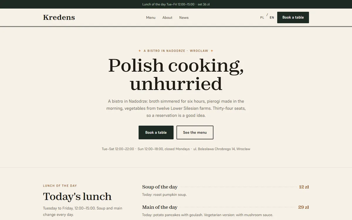 Kredens, English version — cream hero with the bistro headline, booking and menu buttons, and the lunch of the day with prices